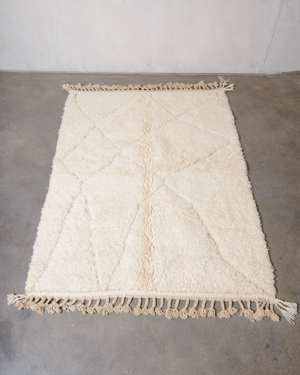 Modern, designer, handcrafted Berber rug from Morocco. Beniourain carpet with minimalist design, natural wool pile and a fluffy texture.